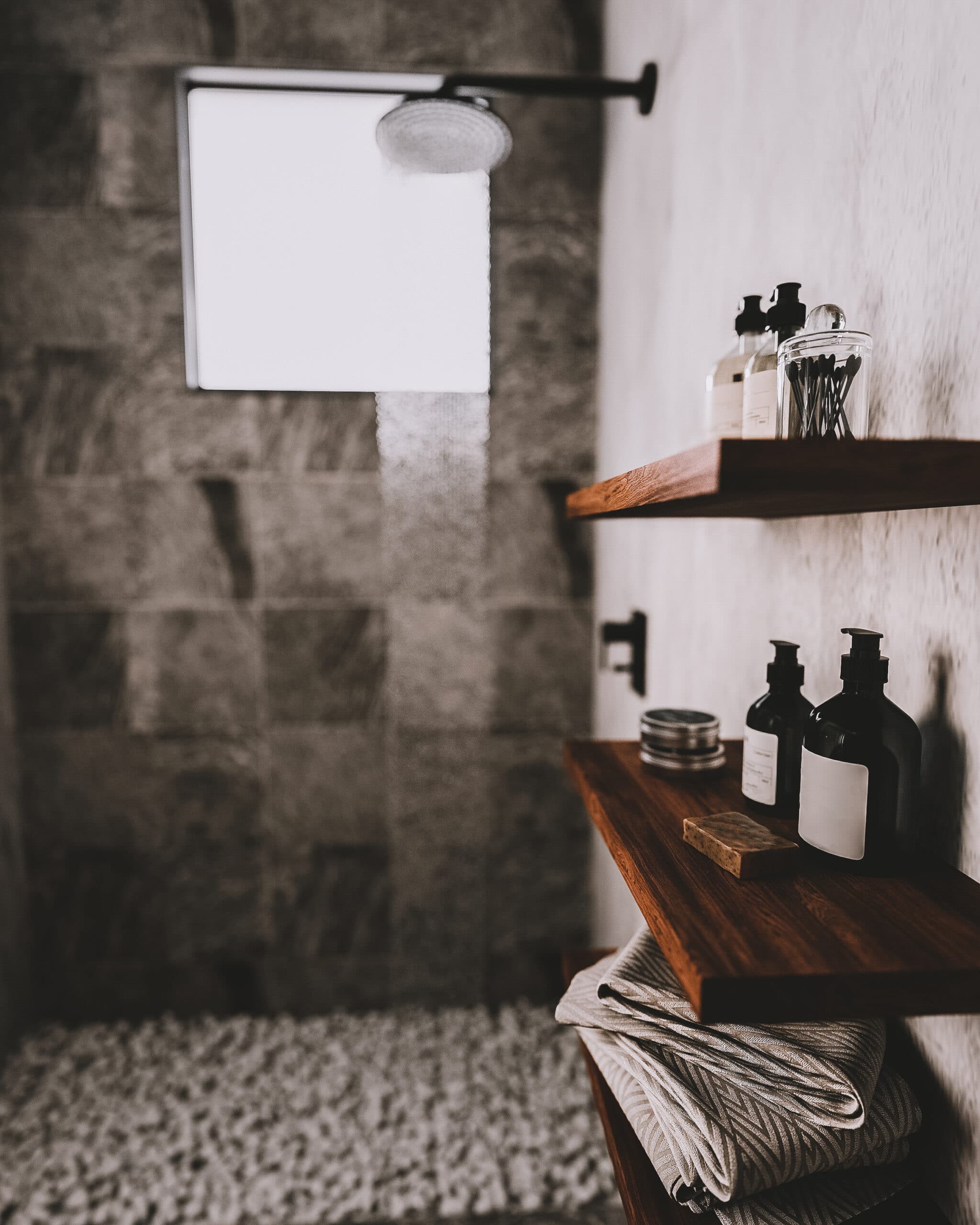 bathroom wooden shelves with bath utensils and cosmetics in mode