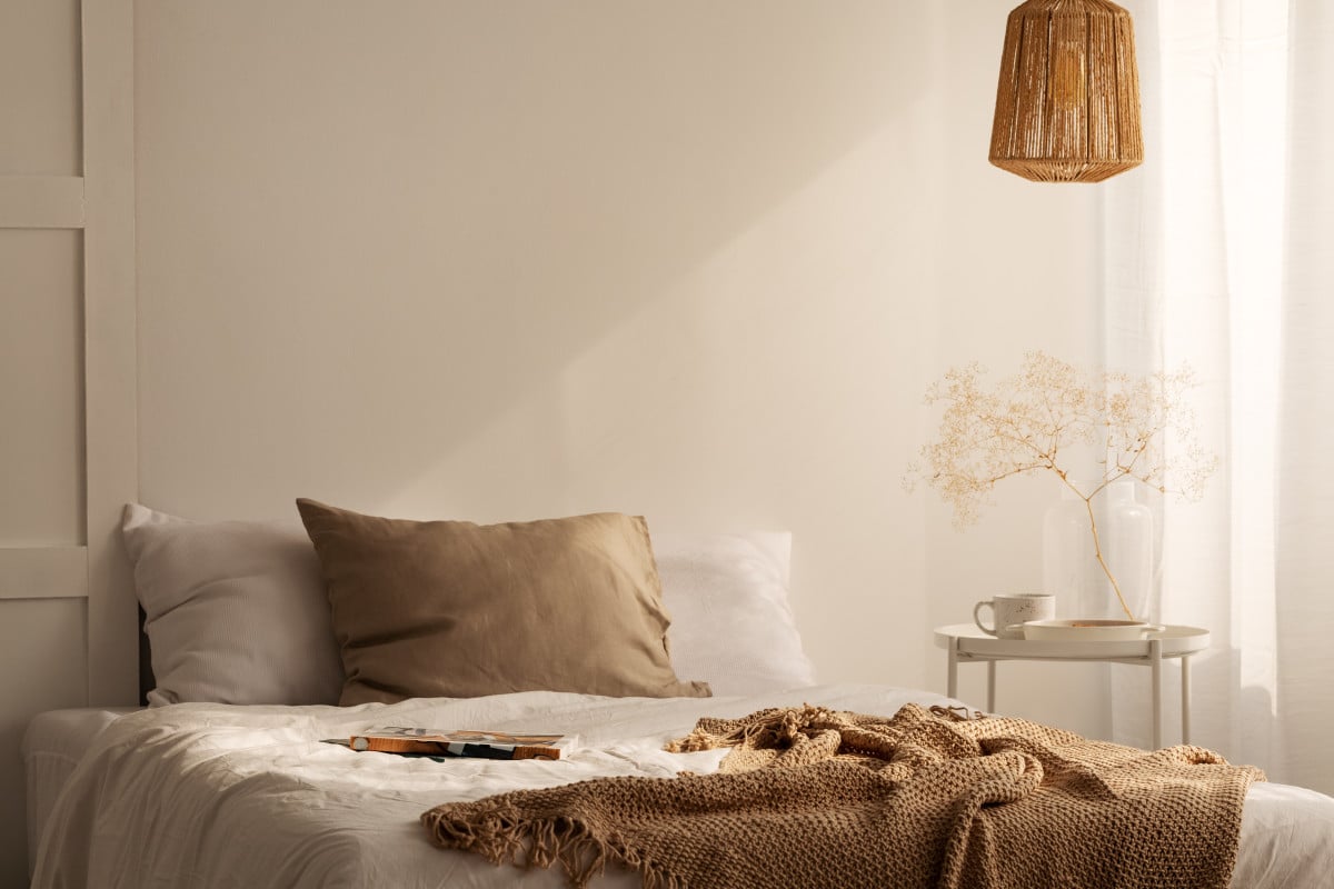 closeup of bed with beige blanket and linen pillow 2021 08 26 15 45 33 utc