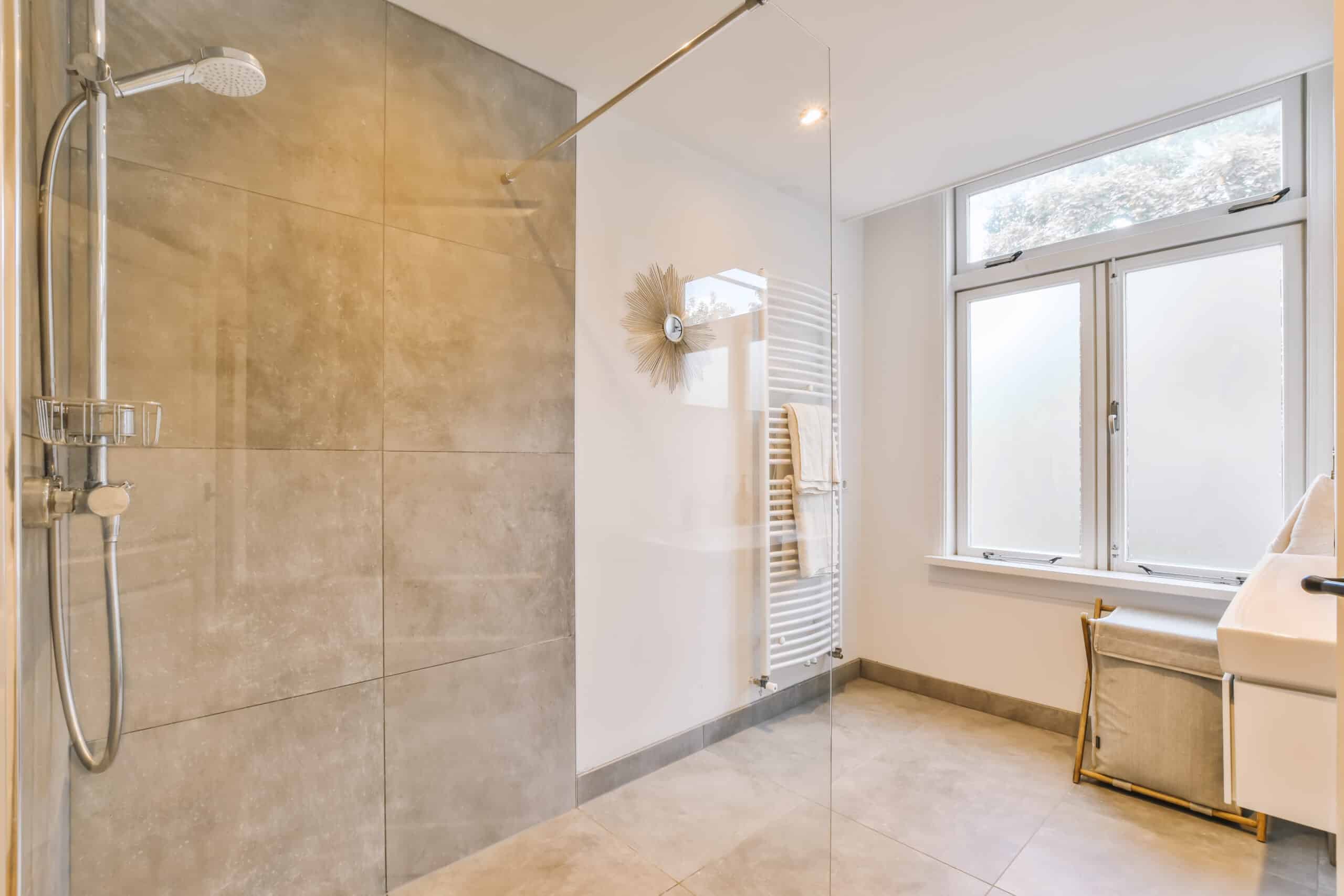 designer bathroom with beige tiled floor