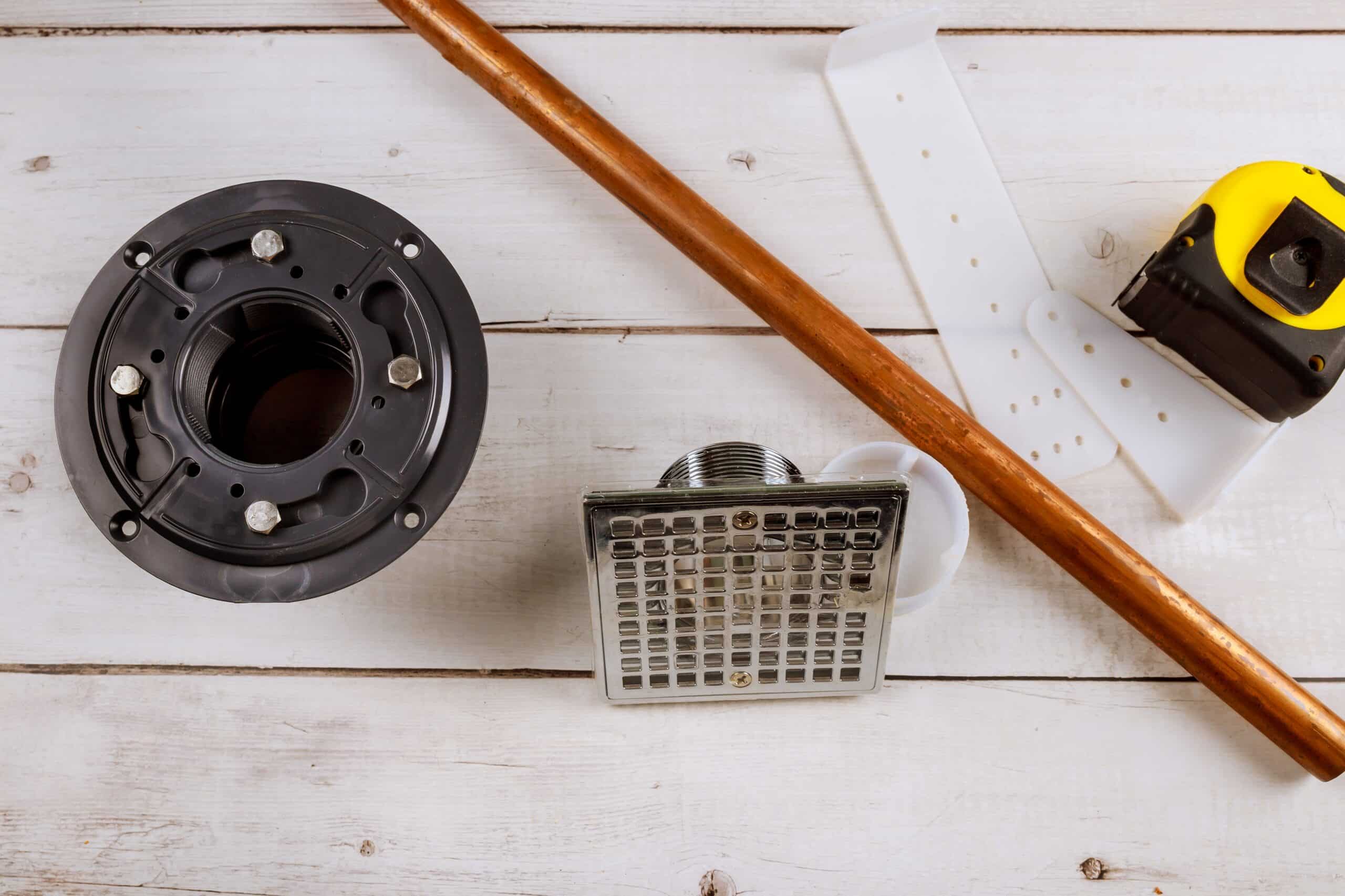 floor drain in shower, tools plumbing on a copper pipes