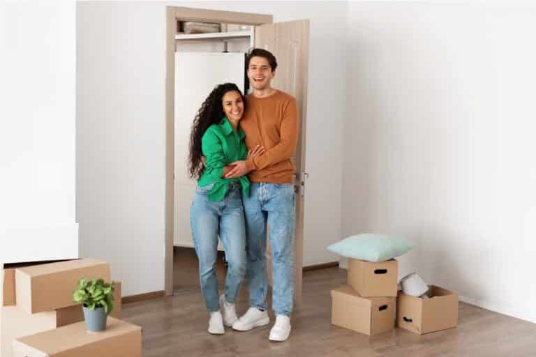 happy man and woman posing on moving day 2022 12 16 08 05 35 utc