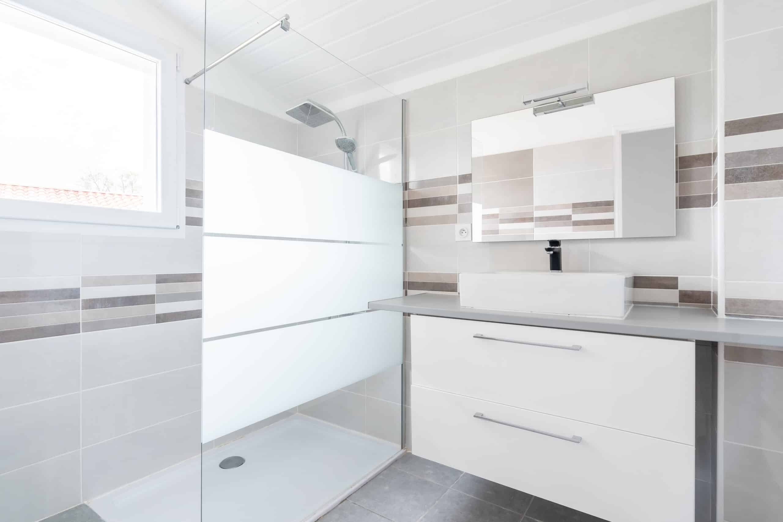 home bathroom, bright new bathroom interior with tiled glass shower, vanity cabinet, interior designed white and brown