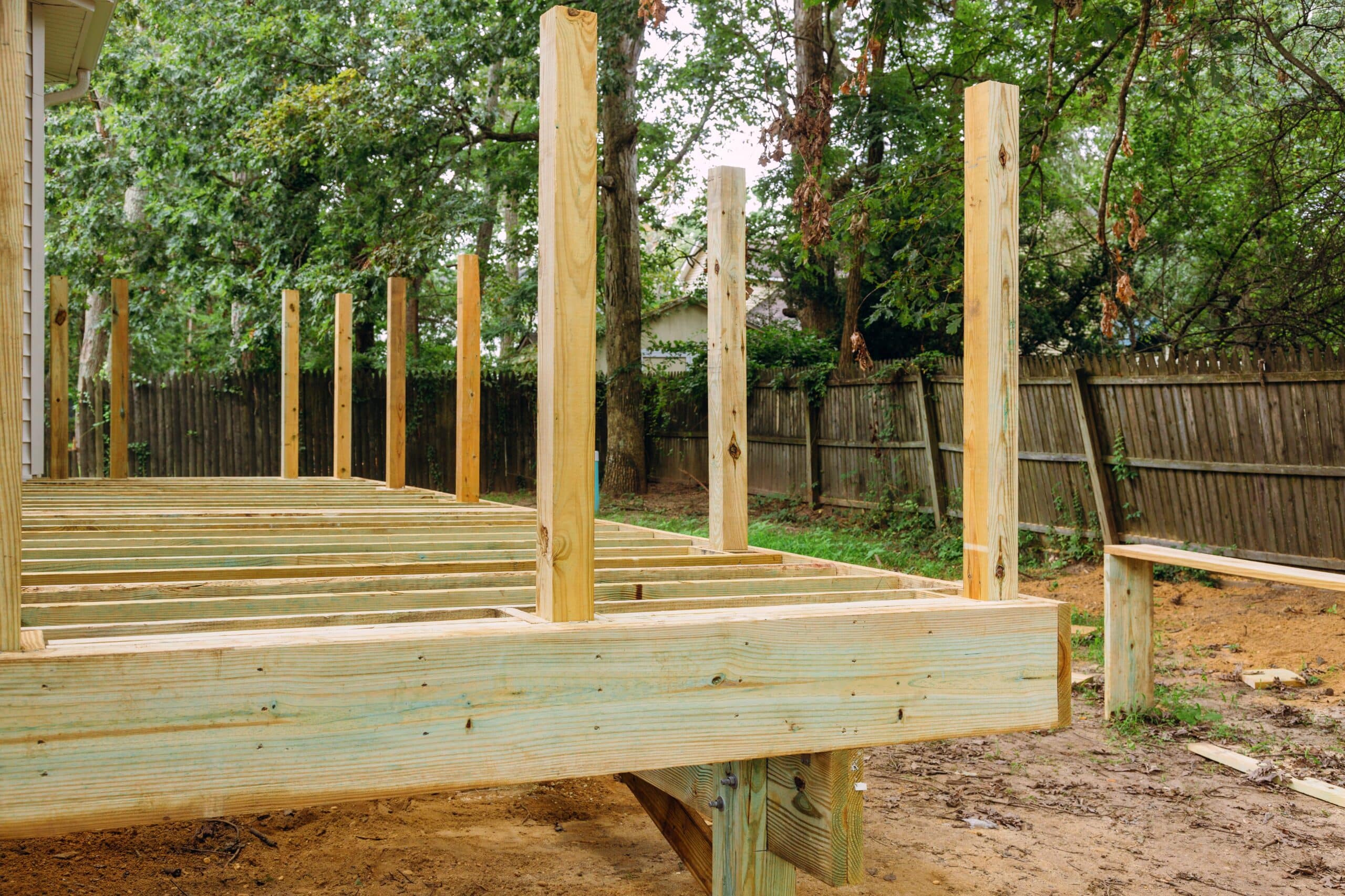 installing wood floor for patio deck with new wooden planks