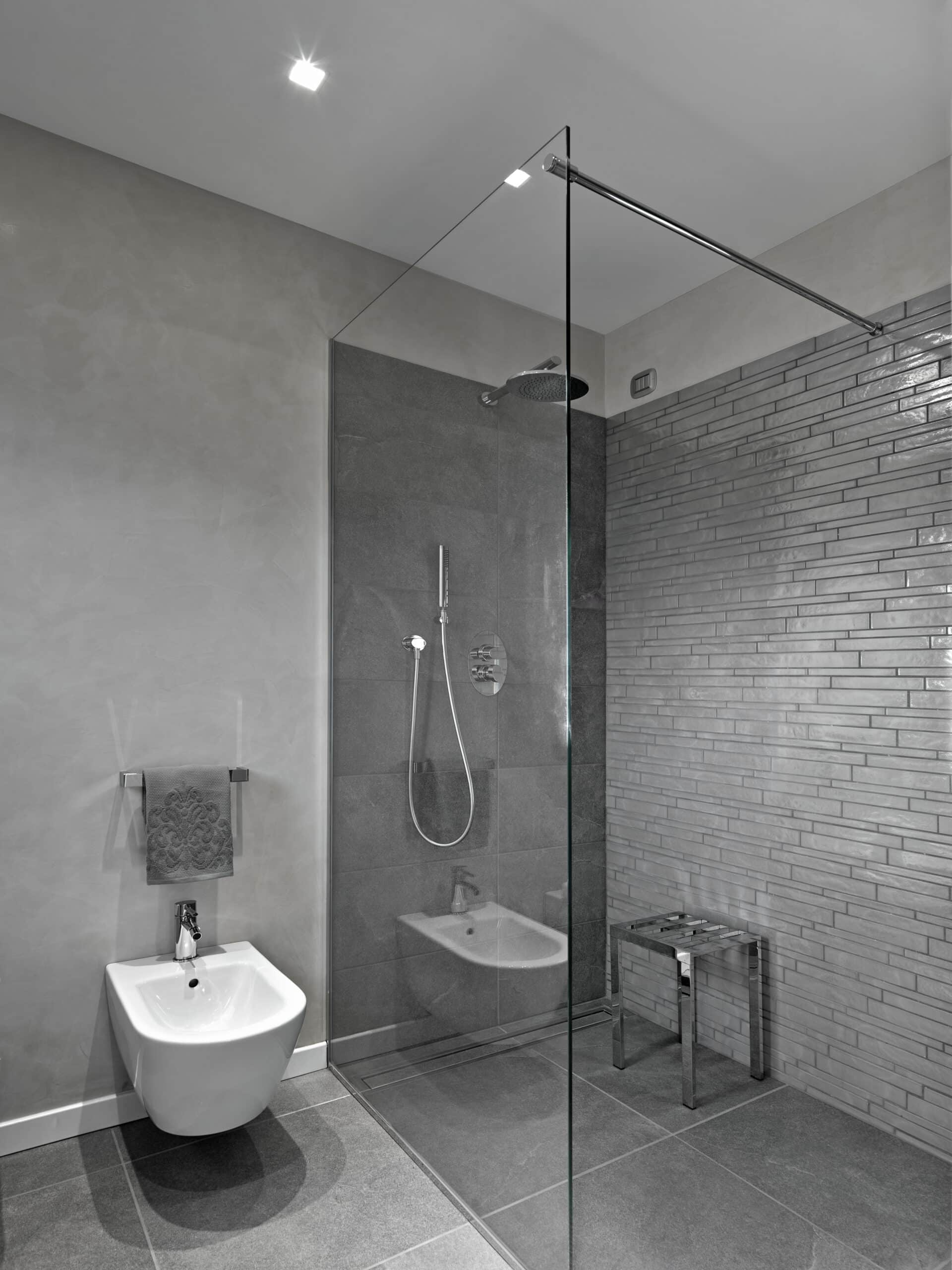 modern bathroom interior with a glass shower box