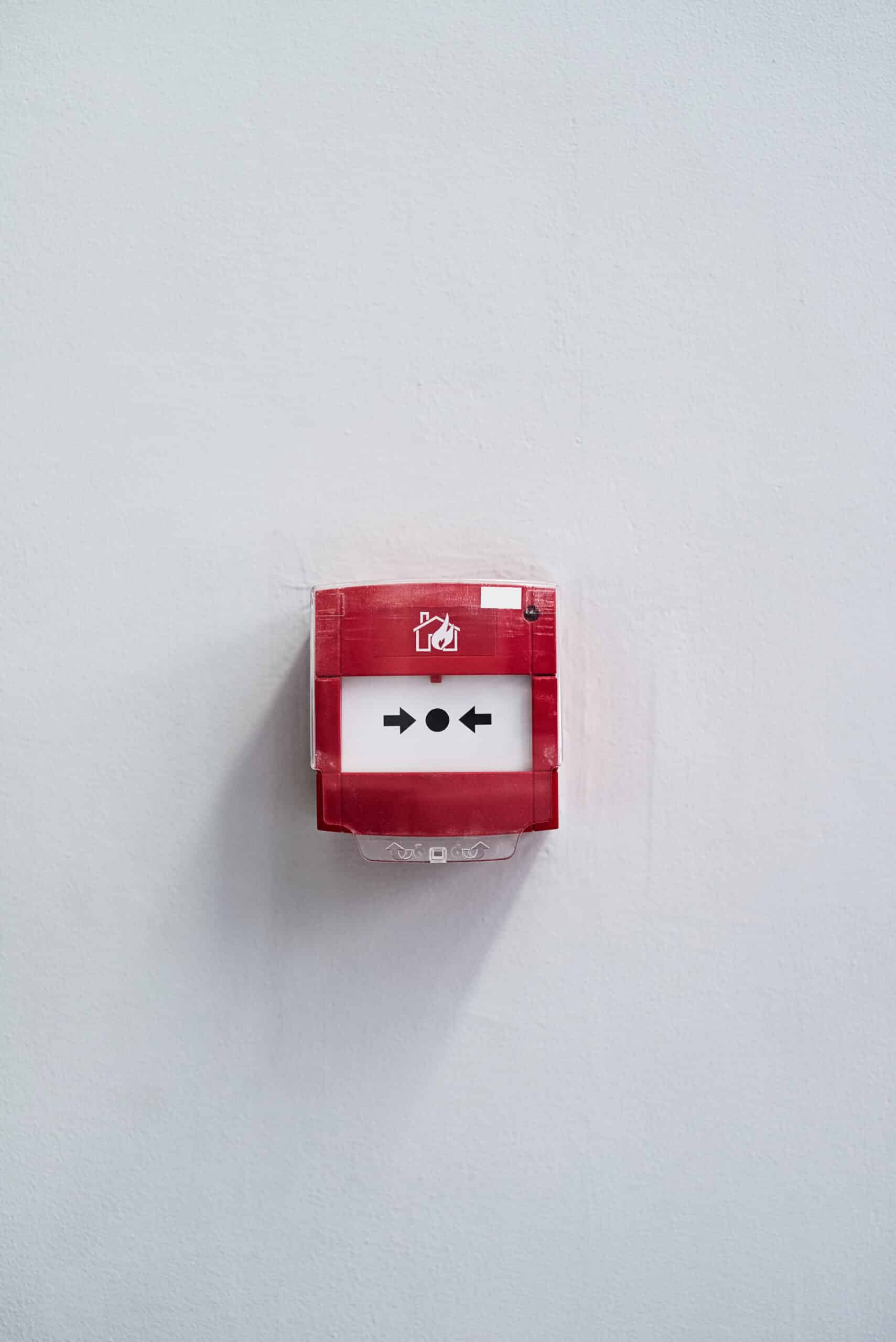 press in case of an emergency. shot of a fire alarm on a wall