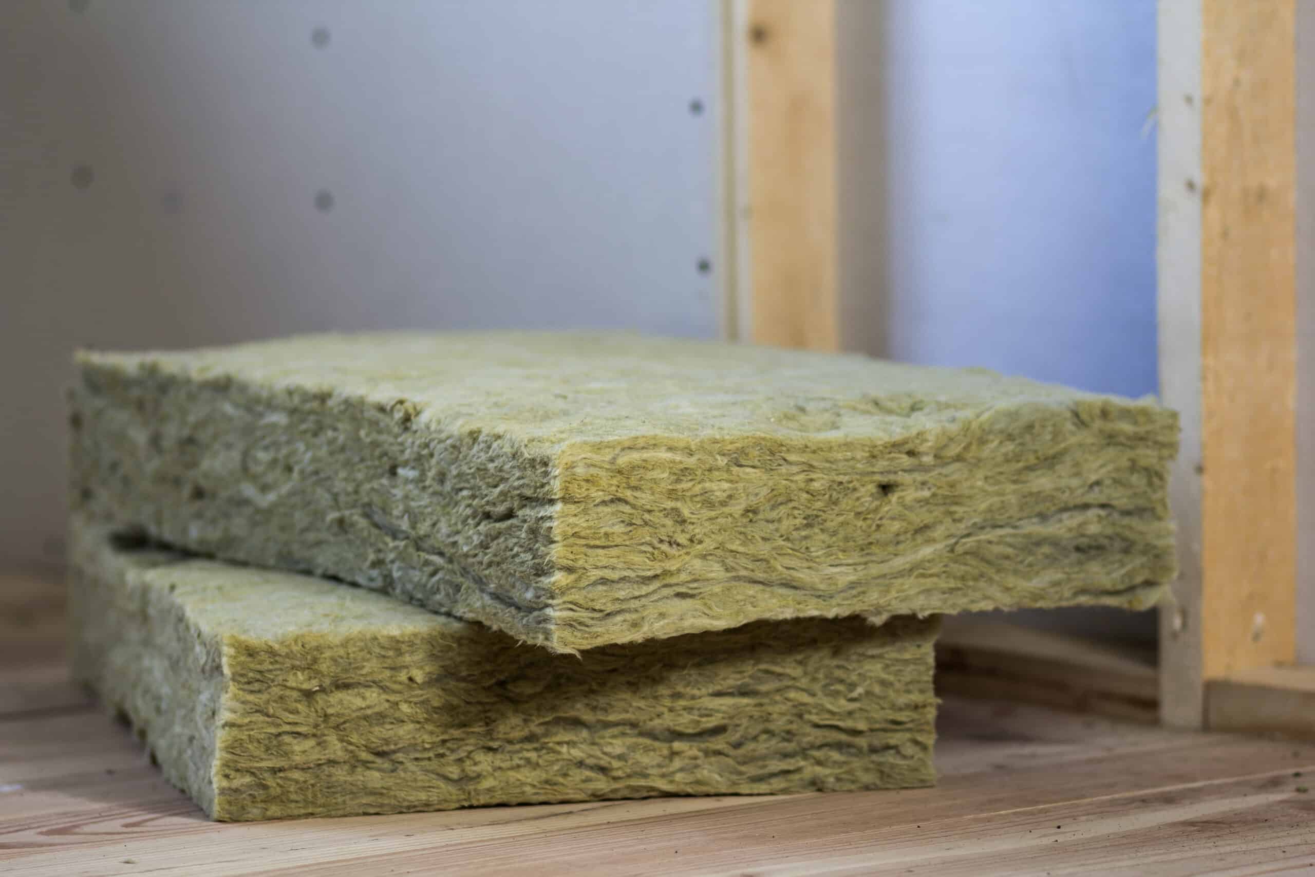wooden frame for future walls with drywall plates insulated with rock wool and fiberglass insulation staff for cold barrier. comfortable warm home, economy, construction and renovation concept.