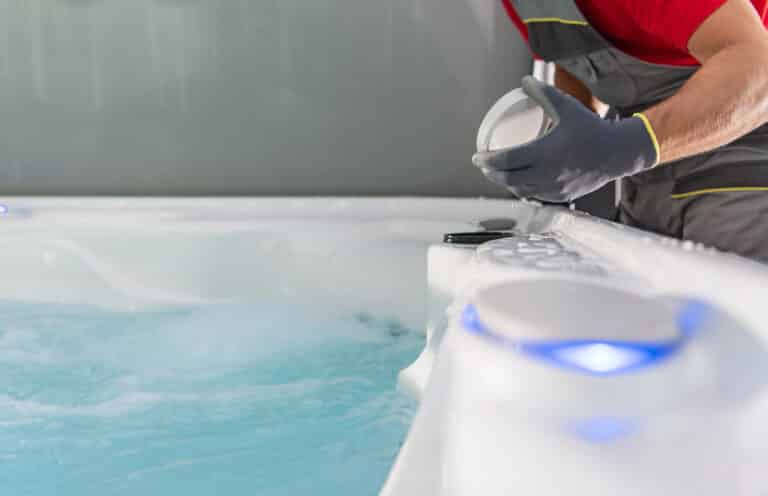 hot tub spa technician checking on jacuzzi filter