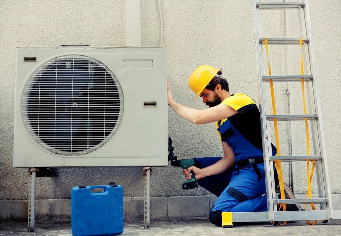 repairman working on air conditioner