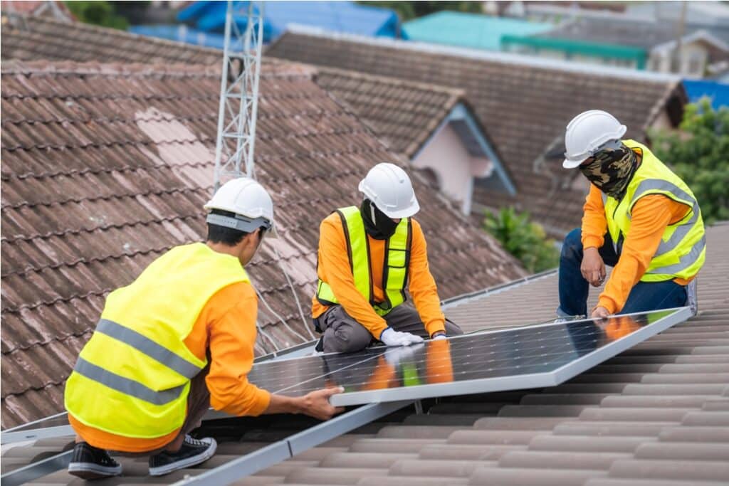 service engineer installing solar cell on the roof 2023 11 03 16 49 01 utc (1)