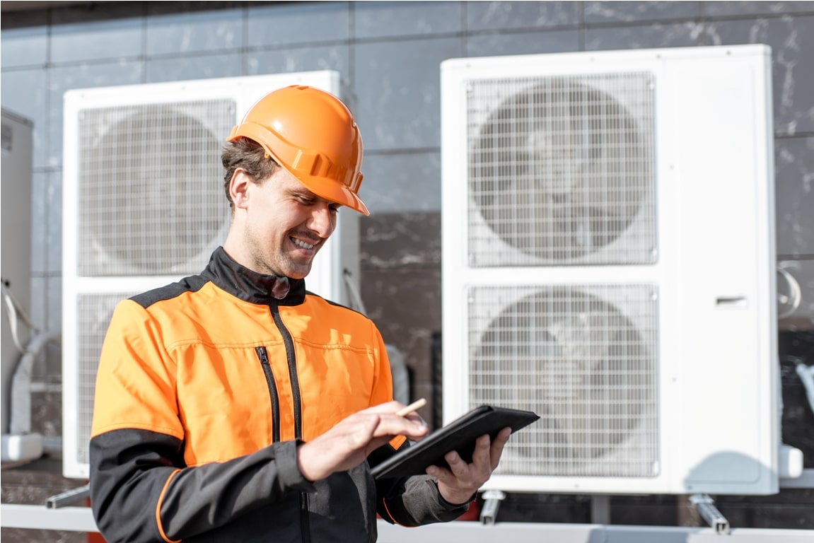 workman servicing air conditioning or heat pump wi 2021 09 01 15 21 12 utc