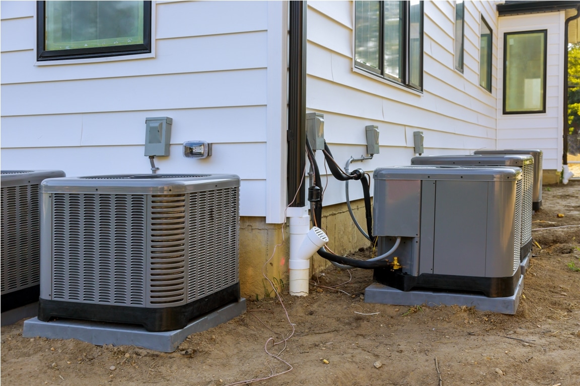 air conditioning system unit installed outside facade of the new house