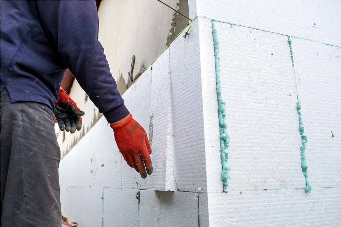 construction worker installing styrofoam insulatio 2022 05 20 18 27 16 utc