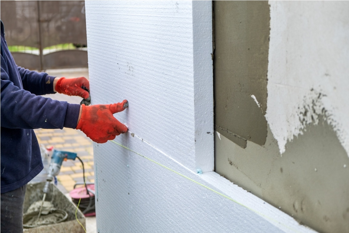 construction worker installing styrofoam insulatio 2022 11 17 13 34 28 utc