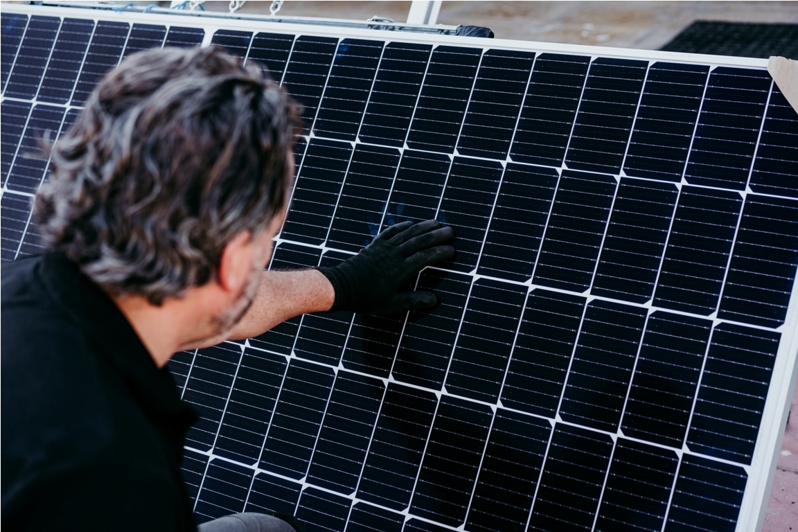 technician man checking solar panels for self cons 2022 10 11 20 20 47 utc