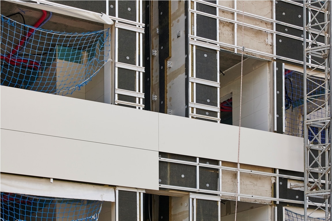 building facade under construction. insulation material and tiles