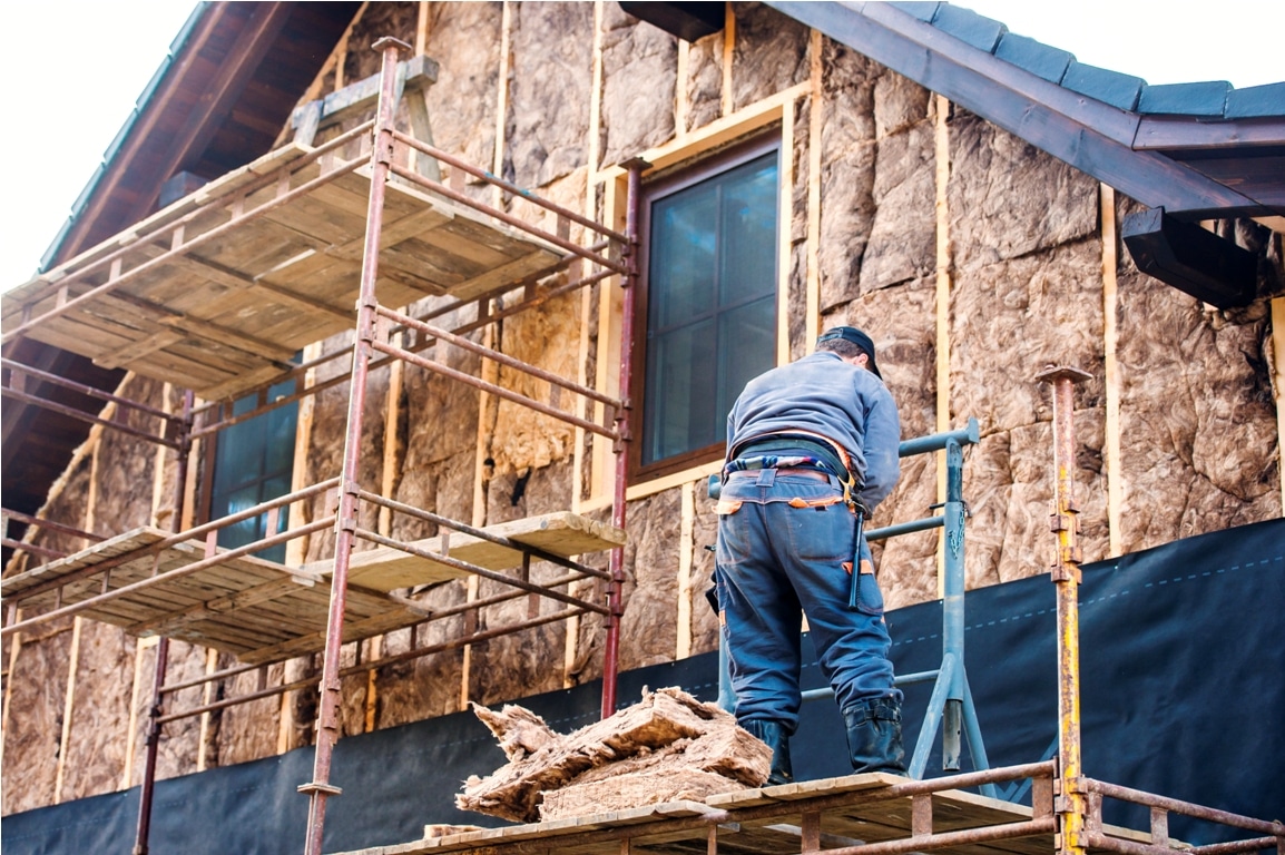 construction worker thermally insulating house fac 2021 08 26 12 08 26 utc