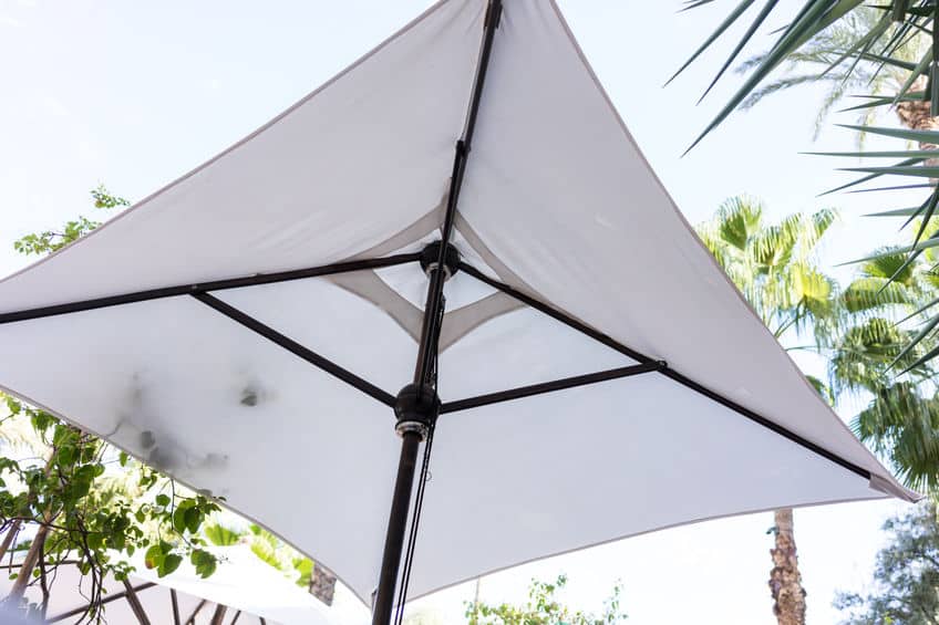 white sun umbrella for shade low angle view